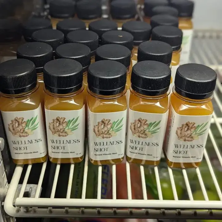 Rows of Cameron Juice Wellness Shots with ginger-and-turmeric labels